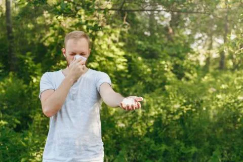 Young man suffering spring pollen allergy Stock Photos