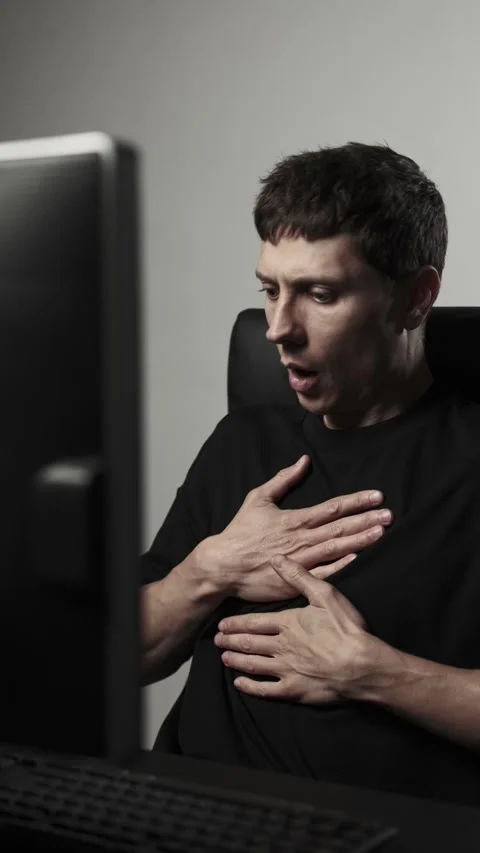 Young man suffering sudden panic attack at home office remote work stress Stock Footage 318442770