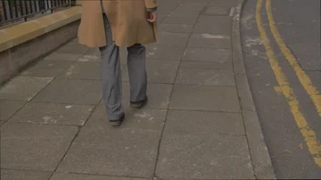 Young man in suit walking through London in Slow motion  Stock Footage 85667469
