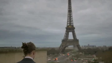 Young man in suit walks to wards the Eiffel tower in Paris France, businessman Stock Footage 85676317