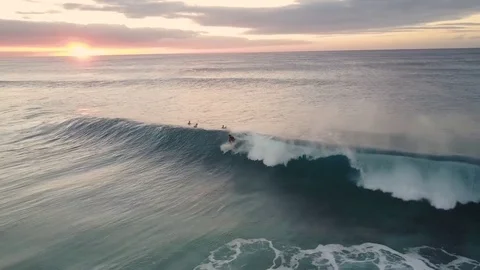 Young Man Surfing A Big Wave At Sunset From A Tropical Beach Video stock 78076242