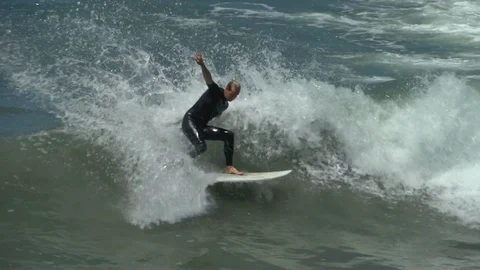 Young man surfing Stock Footage 97147022