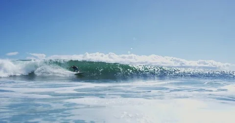 Young Man Surfing Ocean Wave in Slow Motion Stock Footage 76283315