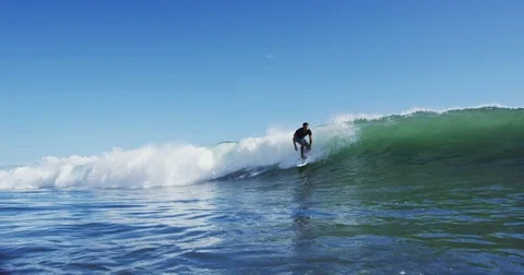 Young Man Surfing Ocean Wave in Slow Motion Stock Footage 76284024