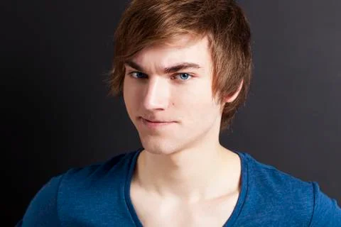 Young man with a suspicious face Stock Photos