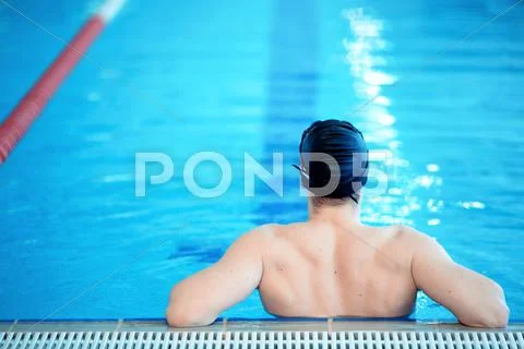 Young man in swimming pool Stock Photos