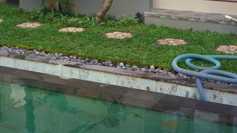 Young man swimming pool serviceman checking chlorine, PH and other chemical Stock Footage 110824474