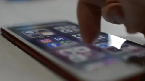 Young man swipe iphone display. iphone touch screen display. Vidéo 237439145