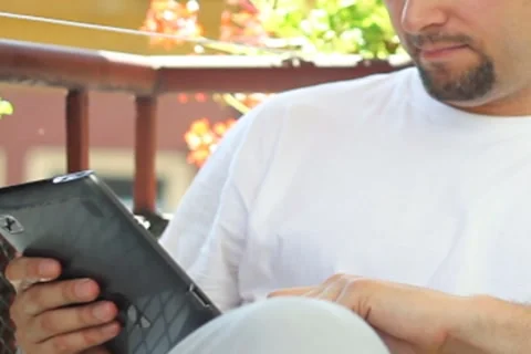 Young man with tablet computer, outdoors Stock Footage 8515923