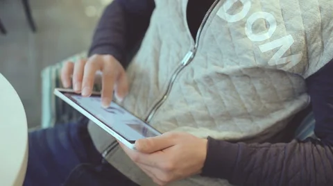 Young man with tablet computer sitting in cafe Stock Footage 58642004