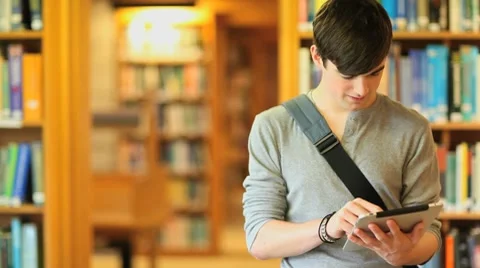 Young man with a tablet Stock Footage 8576851