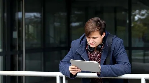 A young man with a tablet Stock Footage 69148042