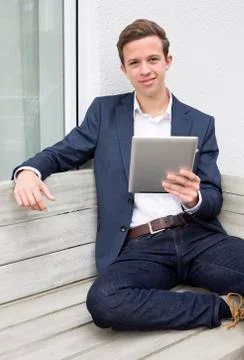 Young man with tablet Stock Photos