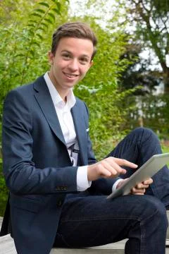 Young man with tablet Stock Photos