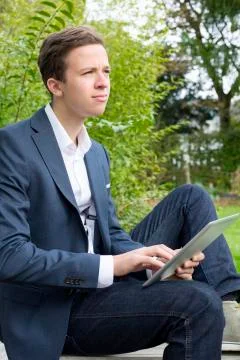 Young man with tablet Stock Photos