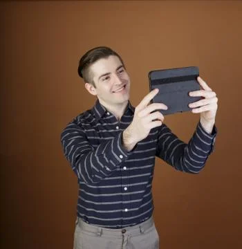 Young man with tablet Stock Photos