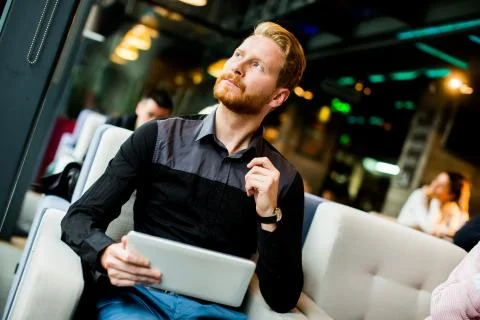 Young man with tablet Stock Photos