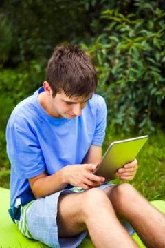 Young Man with a Tablet Stock Photos