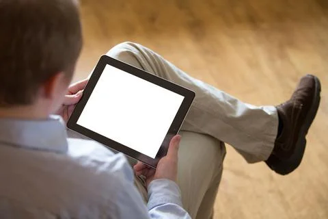 Young man with a tablet Stock Photos