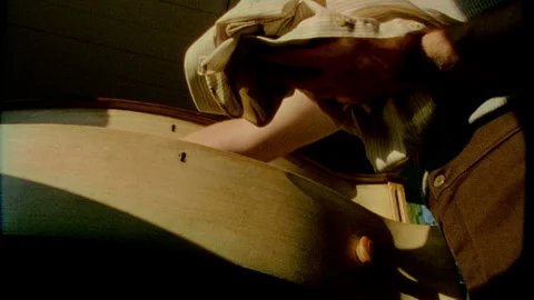 A young man takes clothes from the draw takes #1, #2, #3 Stock Footage 272311638
