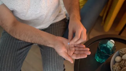 A young man takes a prep in a pill. HIV prevention concept. Stock Footage 169507866