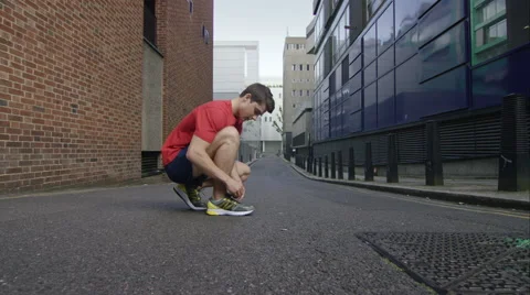 Young man taking a run through the city. Stock Footage 63001396