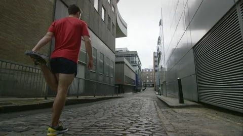 Young man taking a run through the city. Stock Footage 63002159