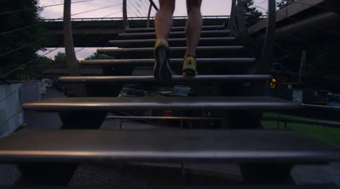 Young man taking a run through the city at night Stock Footage 63008226