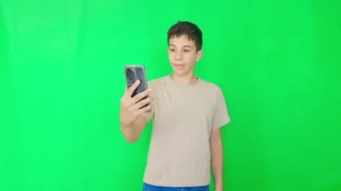 A young man is taking a selfie with his cell phone Stock Footage 311837516