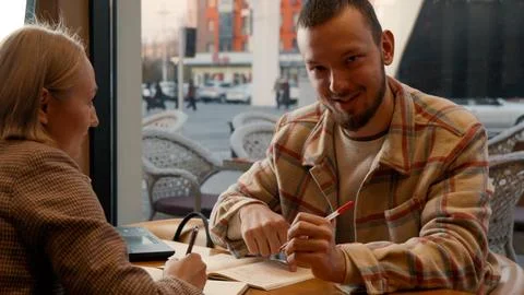 Young man talking and gesturing, actively engaged in a discussion Stock Photos