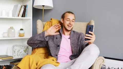 Young man talking and having video chat. Face time. ront-camera. Stock Footage 108789299