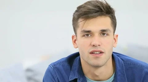 Young man talking to camera Stock Footage 51353025