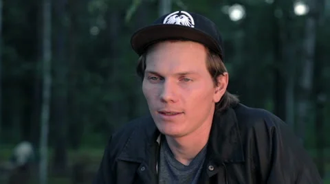 Young man talking to camera as if being interviewed Stock Footage 59240712