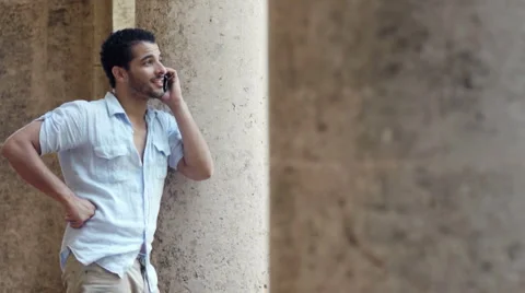 Young man talking on cell phone Stock Footage 5640468