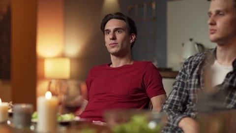 Young man talking to friend at dinner Video stock 114815172