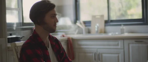 A young man talking to his girlfriend while feeling hurt and upset Stock Footage 132364706