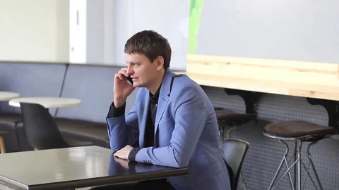 Young man talking on a mobile device Video stock 73965752