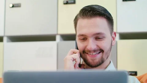 A Young Man Talking on the Mobile Indoors Stock Footage 84772052