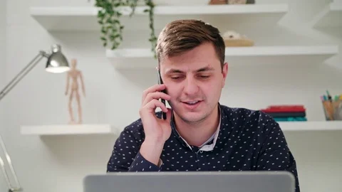 A Young Man Talking on the Mobile in the Office 스톡 동영상 83833746