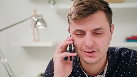 A Young Man Talking on the Mobile in the Office 스톡 동영상 83834845