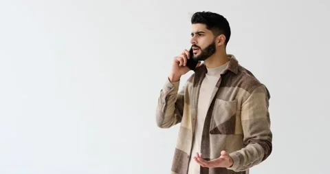 Young man talking on mobile phone Stock Footage 196078992