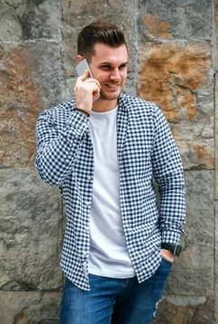 Young man talking on the mobile Stock Photos