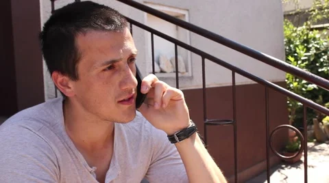 Young man talking on the phone Stockbeeldmateriaal 59856418