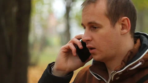 Young man talking on phone Stock Footage 68739705