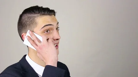 Young man talking on the phone Stock Footage 73663944