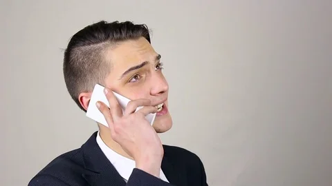 Young man talking on the phone Stock Footage 73664016
