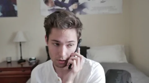 A young man talking on the phone Stock Footage 75486603