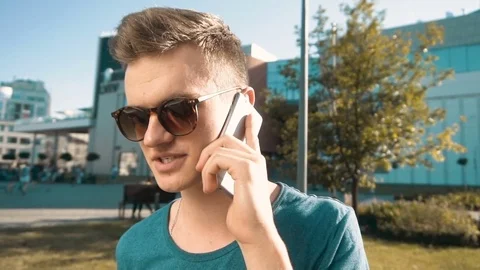 Young Man Talking Phone Видео 76921460