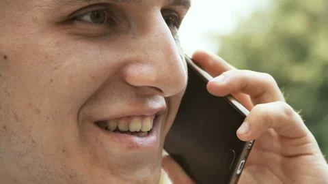 Young man talking on the phone Stock Footage 94903187
