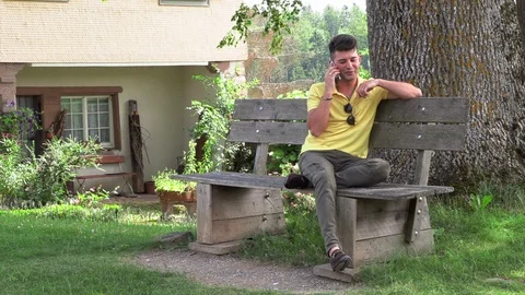 Young man talking on the phone 動画素材 112371210